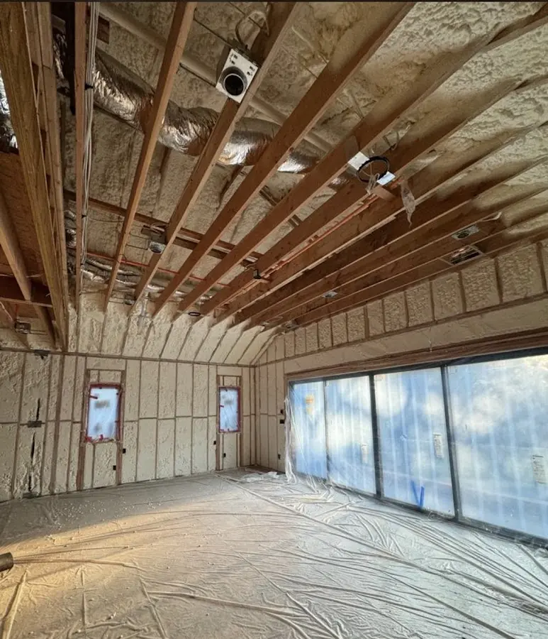 Interior walls and ceiling insulated with spray foam during new construction in Brentwood